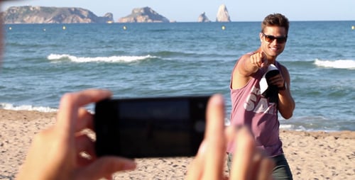 Man Posing for Photo on Sunny Beach
