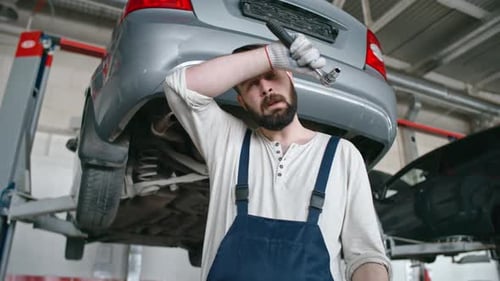 Tired Mechanic at Work