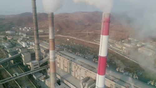 Aerial Drone View of Tall Chimney Pipes with Grey Smoke From Coal Power Plant