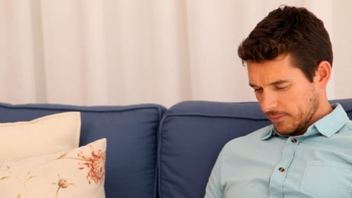 Loving Couple Relaxing Peacefully on a Blue Sofa