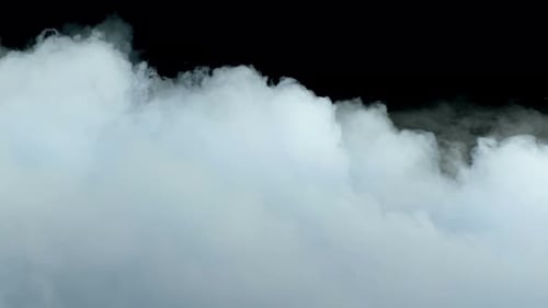 Dense White Smoke Drifting on Black Background