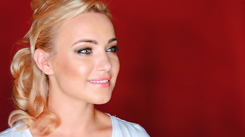 Blonde Woman Smiling with Stylish Makeup Close Up