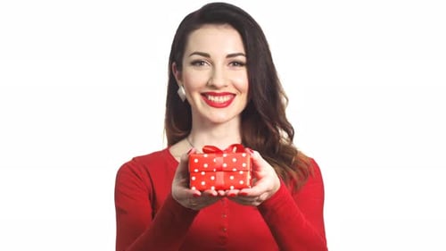 Smiling Woman Presents a Small Gift