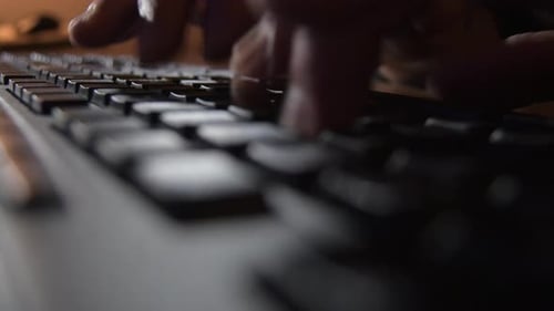 Writing in a Black Keyboard