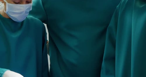 Medical Team Examining Patient Before Surgery