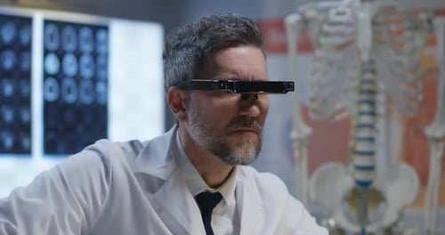Male Doctor Analyzing with VR Technology