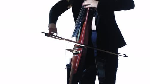 Woman Playing Electric Cello with Bow in Studio