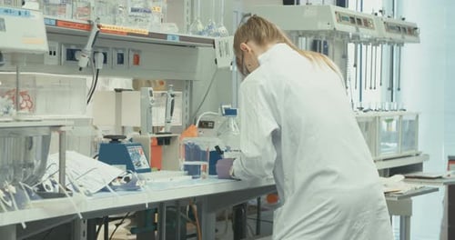 Scientist Working in a Brightly Lit Lab