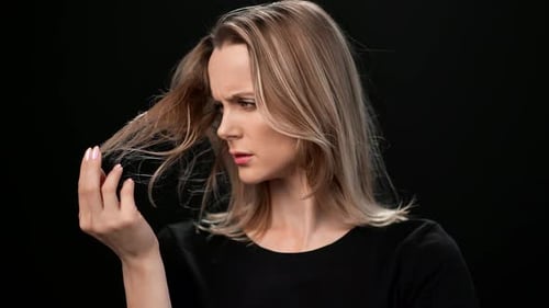 Blonde Woman Posing and Playing with Her Hair