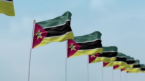 Flags of Mozambique Waving in Wind on Clear Sky