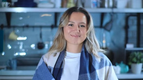 Smiling Woman with Scarf in Indoor Home Setting