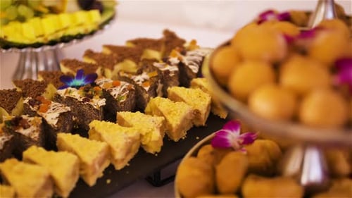 Assorted Cakes and Sweets on Silver Platters