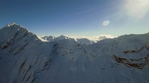 Snowy Mountain Range Aerial View in Winter