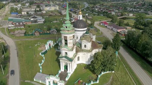 Aerial view of Church in the village. Near the river and bridge