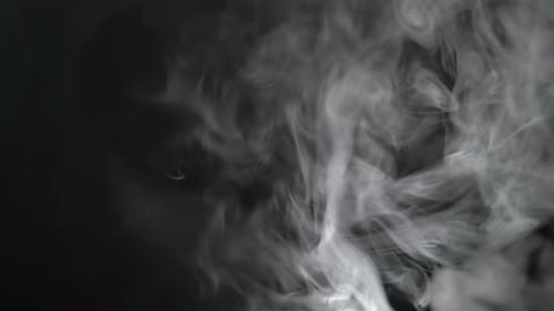 Smoke Fills the Screen on a Black Background