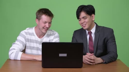 Adults Video Call on Laptop in Workplace