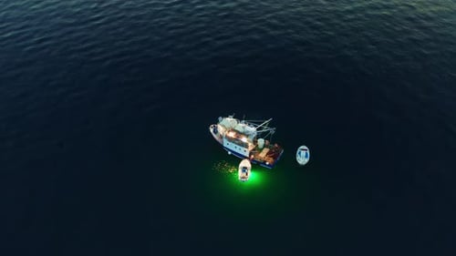 Evening Fishing on Dark Water of Adriatic Sea From Vessel