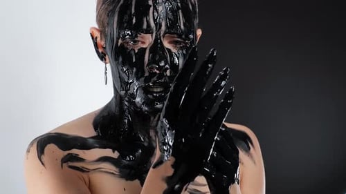 Woman Covered in Glossy Black Paint, Artistic Beauty