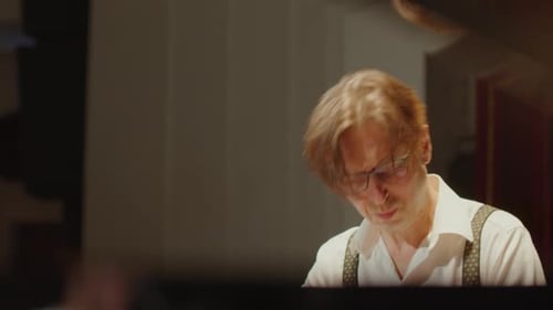 Focused Man Plays Grand Piano Elegantly