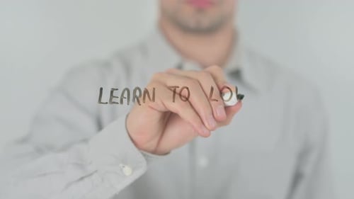 Hand Writes Learn to Love on Transparent Surface