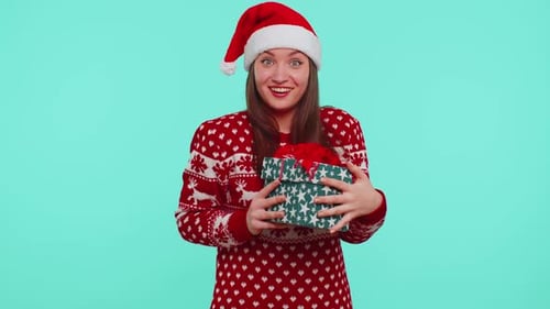 Festive Woman Holding a Christmas Gift