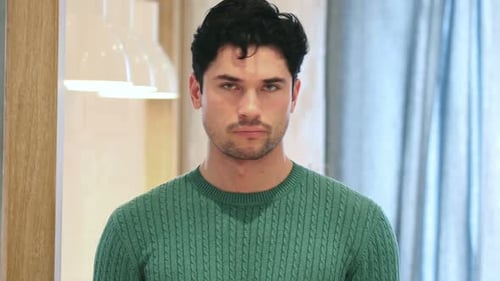 Serious Man Stares Directly into the Camera