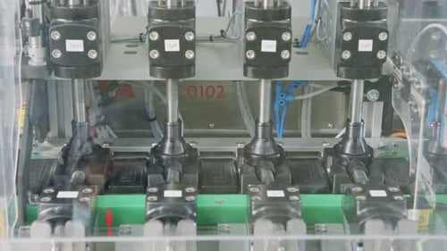 Advanced robotic machine manufacturing parts in an automated assembly line