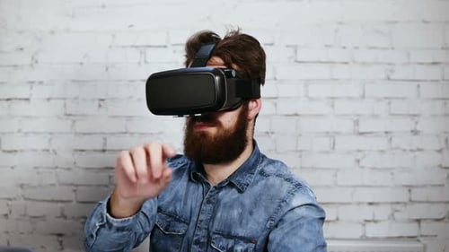 Man Wearing Virtual Reality Goggles in the Office