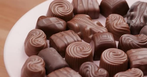 Assorted Chocolate Candies on a White Plate