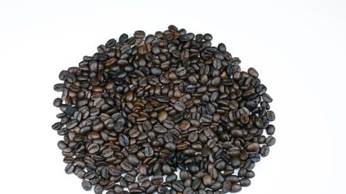 Roasted Coffee Beans Piled on White Background