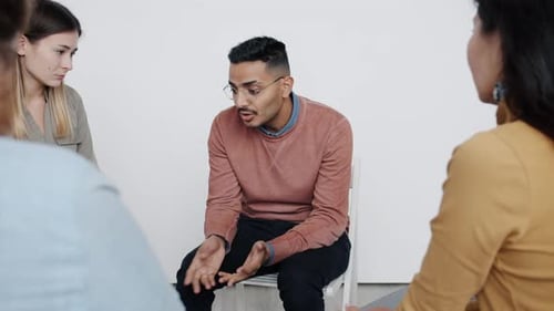 Group Therapy Session with Supportive Gestures