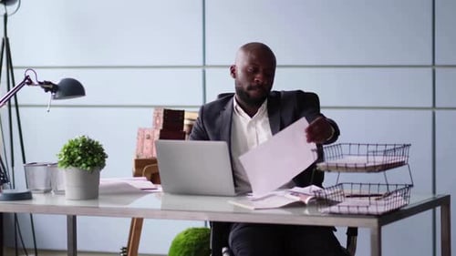 Photo of Handsome Employee Working in Office with Laptop in Front
