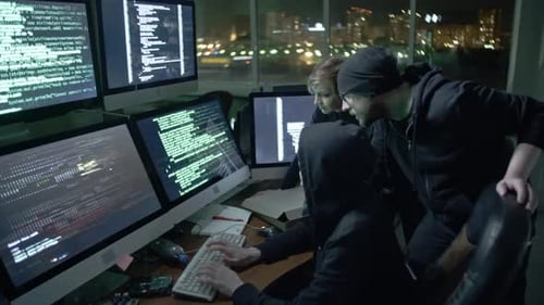 Team of Hackers Working on Computers