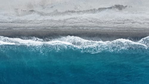 Waves breaking on the sandy beach