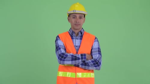 Smiling Construction Worker with Safety Gear on Green Screen
