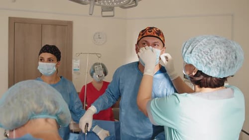 Surgical Team Working In Operating Theatre