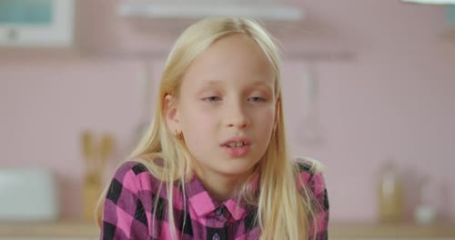 Young School Girl Talking Looking at Camera. Webcam View of Child Speaking. Attractive Young Girl