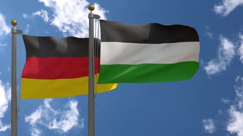 Realistic German and Palestinian Flags Waving Together in Blue Sky