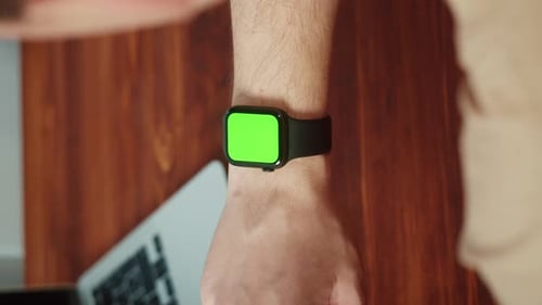 Vertical Video of Man Student Using Smartwatch with Chroma Key Closeup