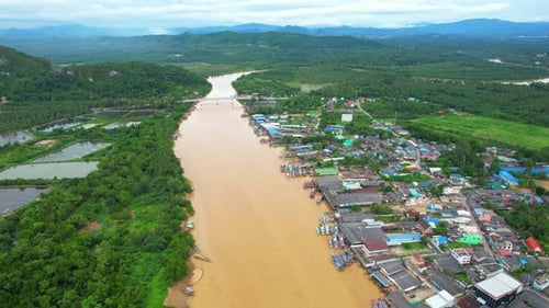 An aerial view over the river, fishing villages and fishing boats