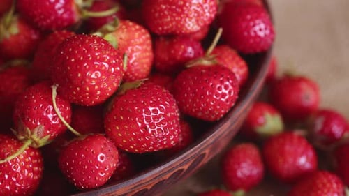 A Beautiful Red Healthy Strawberry in Large Quantities Lies in a Plate on Top of Each Other