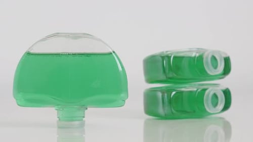 Toilet bowl deodorizers on white slow tilt 4K footage