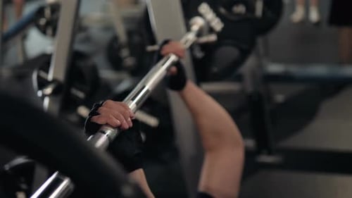 Closeup of a Strong Man's Hands with Talc Getting Ready to Weightlifting at the Garage Gym