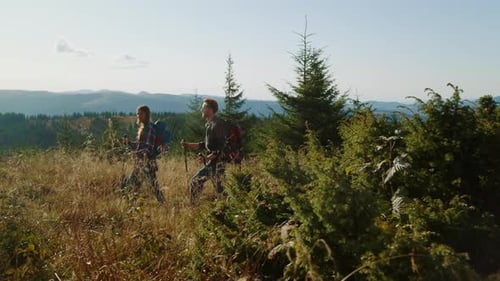 Hikers Explore Mountain Ridge in Rural Nature