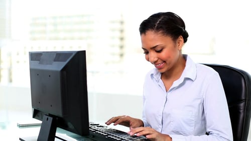 Woman Works at Computer in Modern Office