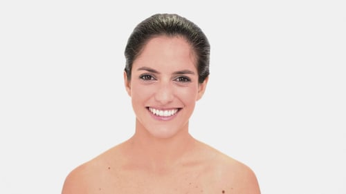 Thoughtful Brunette Woman Applying Mascara