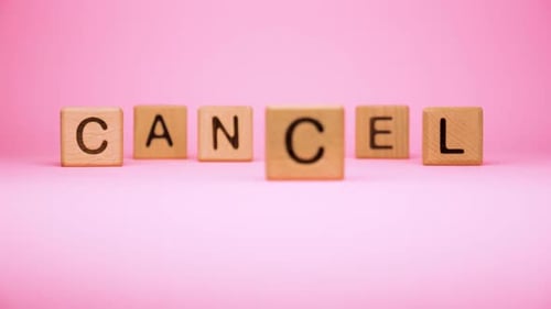 Cancel Word on Wooden Cubes. Cancelled Word Made with Building Blocks. Mass Gathering Cancelled