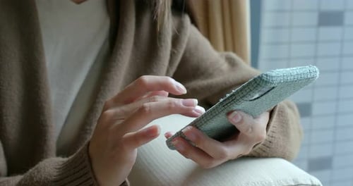 Hands Using Mobile Cellphone Device at Home