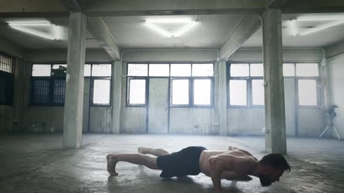 Shirtless Man Exercising with Pushups and Jumps