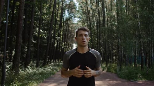 Young Handsome Man Train for Marathon Run in Park